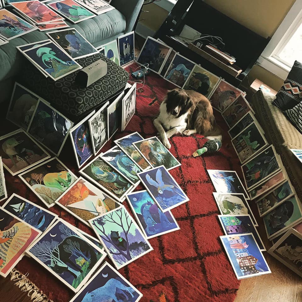 Balu surrounded by art prints