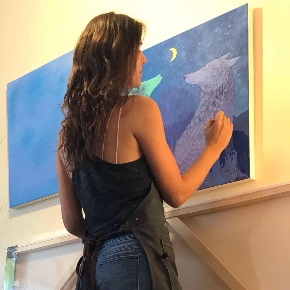 Elaine Thompson painting in her studio